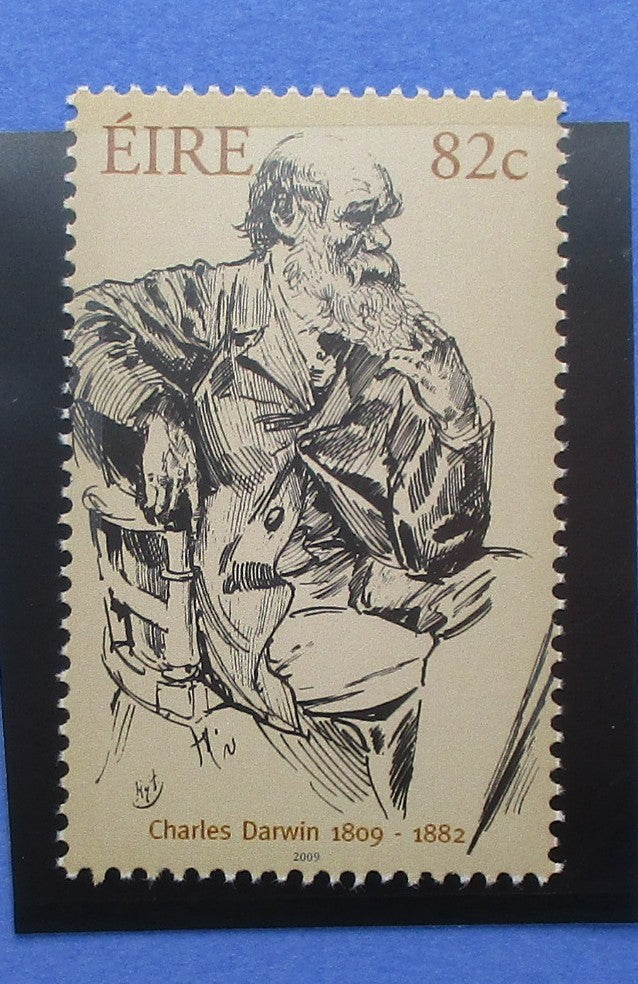 Stamp featuring a black and white illustration of Charles Darwin with text 'ÉIRE 82c' and 'Charles Darwin 1809-1882'.