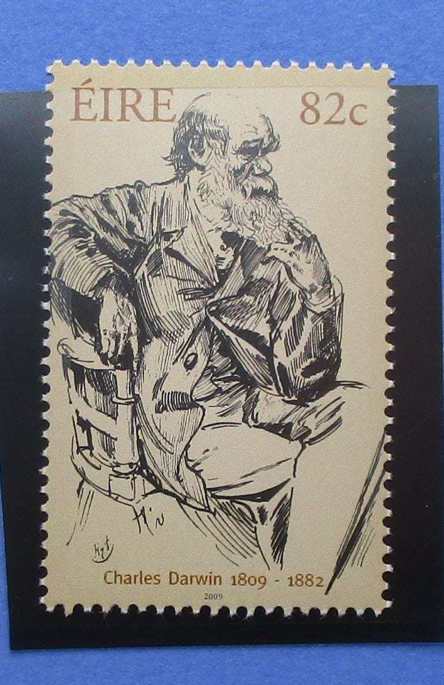 Stamp featuring a black and white illustration of Charles Darwin with text 'ÉIRE 82c' and 'Charles Darwin 1809-1882'.