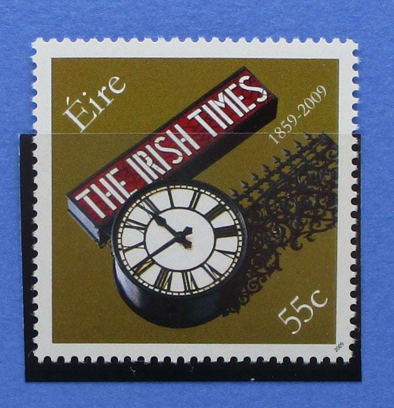 Stylized postage stamp with 'The Irish Times' logo and clock design on a blue background