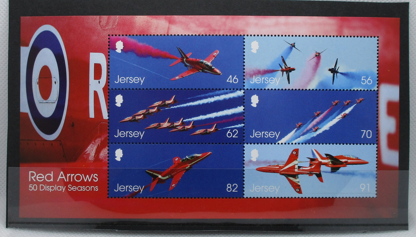 postage stamps featuring Red Arrows aircraft on a red and blue background