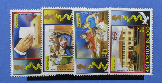 Four Ascension Island postage stamps displayed side by side on a black stand against a blue background. Each stamp features a different illustrated scene with yellow wavy lines and the text 'ASCENSION ISLAND' and denomination details.