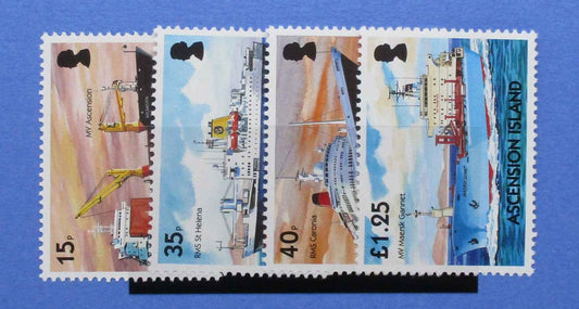 Four postage stamps from Ascension Island featuring illustrations of ships and port equipment, displayed side by side on a blue background.