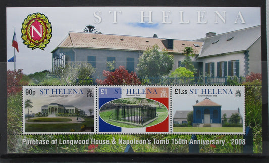A commemorative St. Helena postage stamp sheet for the purchase of Longwood House and Napoleon's Tomb, featuring three stamps and a large printed background image of the house, with the St.